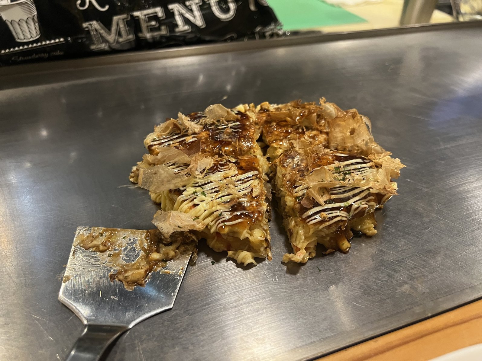 Okonomiyaki as made by professionals in Osaka, Japan