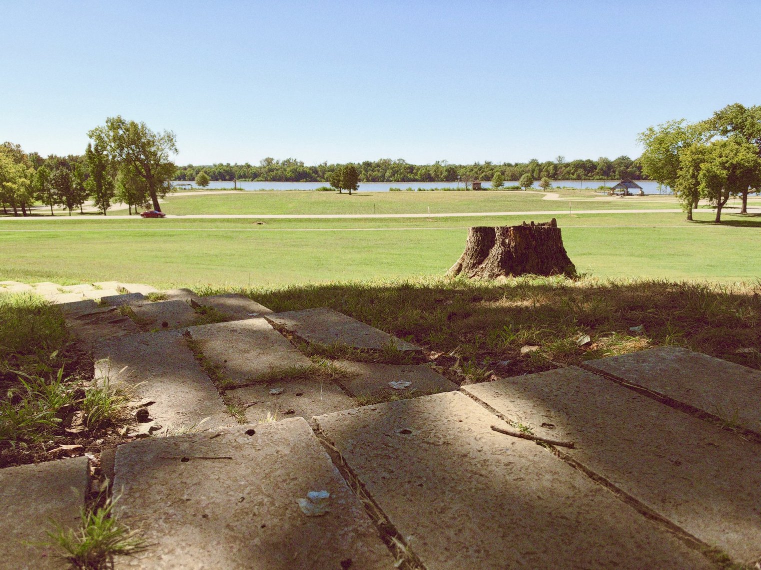 Outside the lodge, a patio overlooking the river ahead.