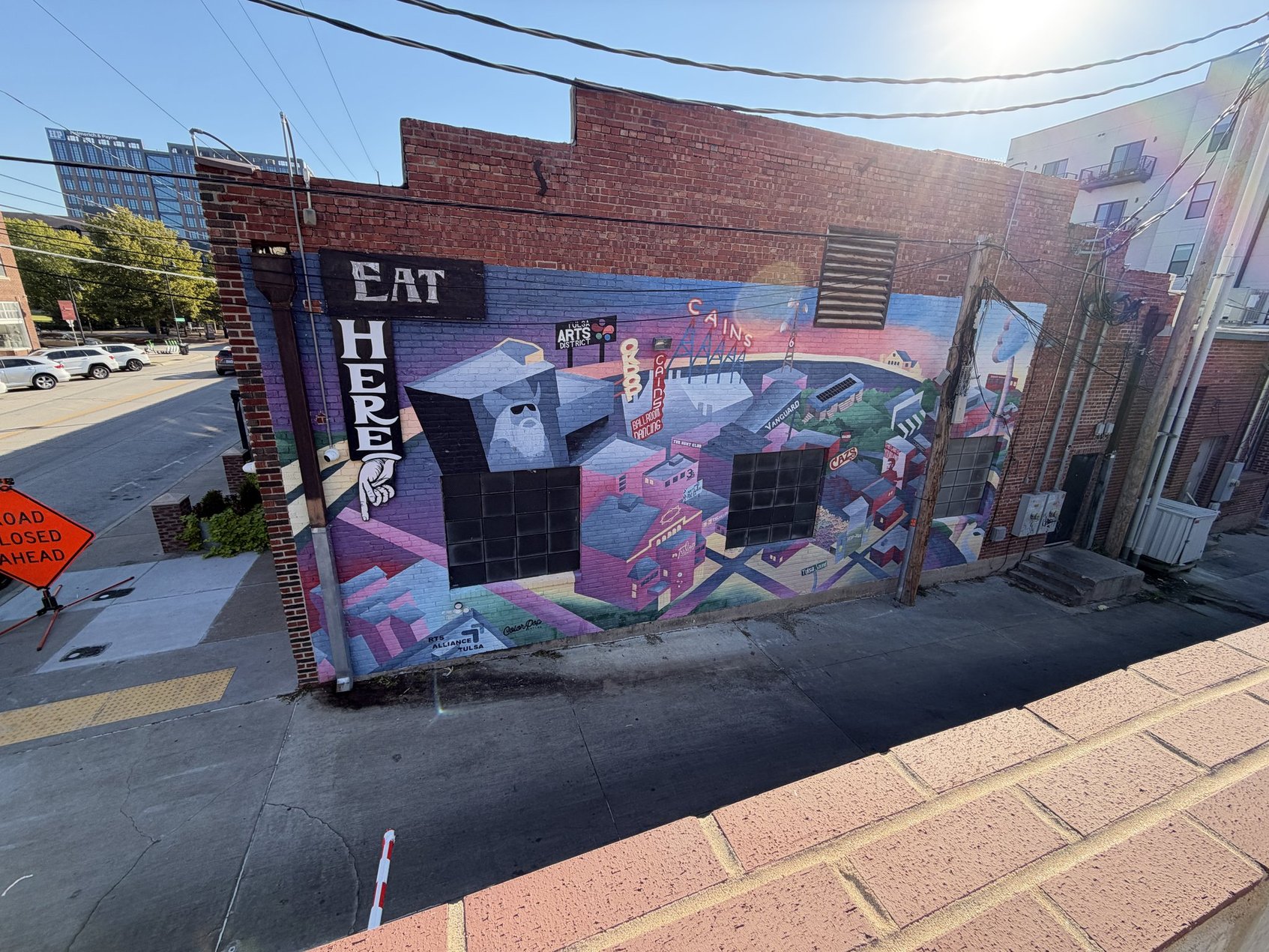 The art mural I ended up spotting near the edge of the parking lot around back.